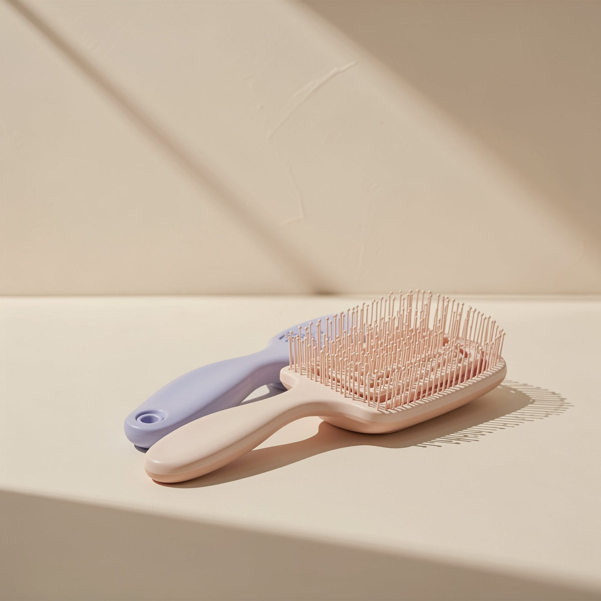 Plastic hairbrush with a large curved shape and hollow ribbed design - view 5