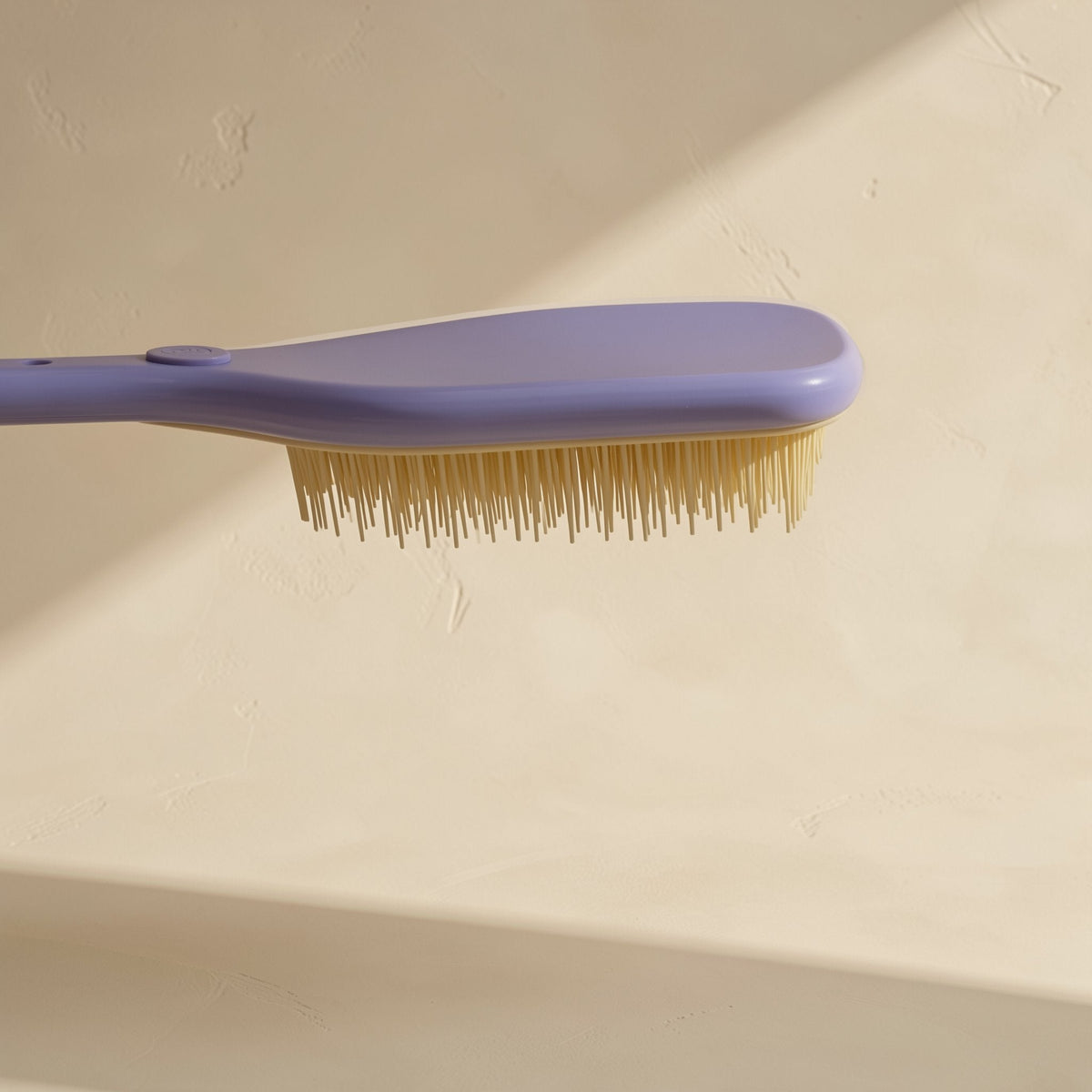 Plastic hair styling brush with multiple teeth and a straight handle - view 4