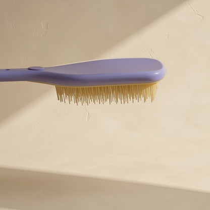 Plastic hair styling brush with multiple teeth and a straight handle - view 4
